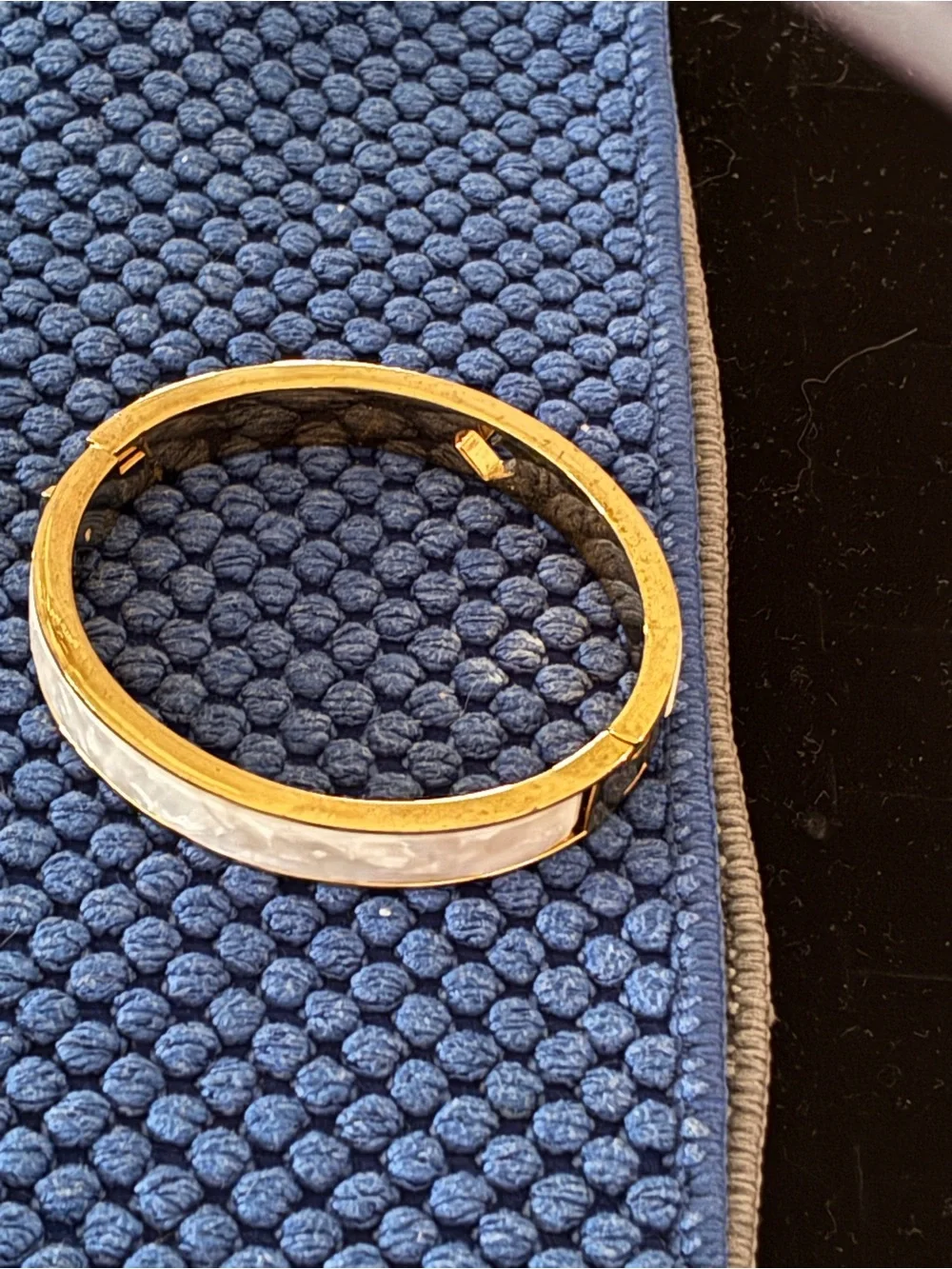 Kate Spade gold-tone bangle with cream enamel and heart detail